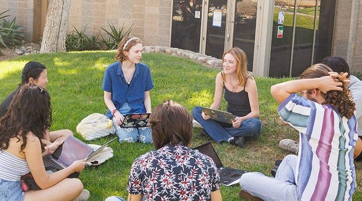 a study group sits in a circle on the mounds